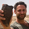 man holding a Nubian point