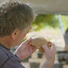 a man holding a fossil