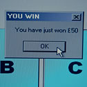 Close up of a pop-up window on a computer screen that says You have just won £50 with an OK button below the text